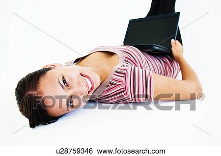 Stock Photograph - Confident woman with laptop. Fotosearch