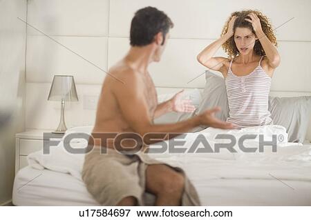 Couple arguing in bedroom View Large Photo Image Stock Photo - Couple arguing in bedroom. Fotosearch