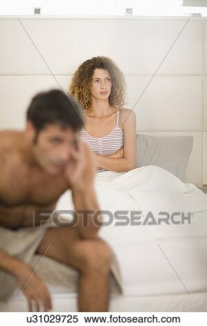 Stock Photography - Couple arguing in bedroom. Fotosearch