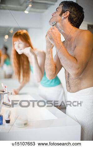 Couple brushing teeth and shaving View Large Photo Image Stock Image - Couple brushing teeth and shaving. Fotosearch