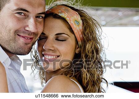 Stock Photograph - couple cuddling. Fotosearch