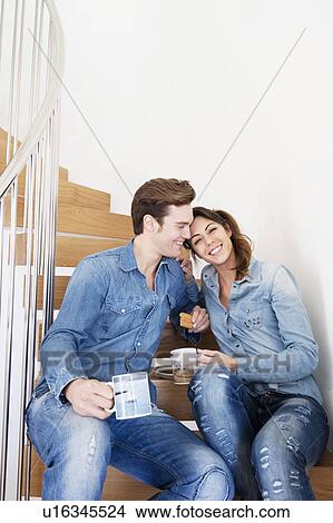 Couple drinking coffee on stairs View Large Photo Image Picture - Couple drinking coffee on stairs. Fotosearch