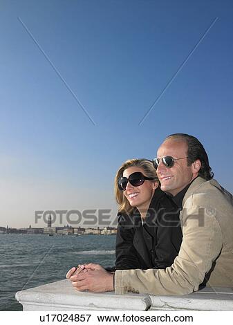 Couple enjoying the beauty of Venice View Large Photo Image Stock Photo - Couple enjoying the beauty of Venice. Fotosearch