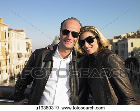 Stock Photo - Couple enjoying the beauty of Venice. Fotosearch