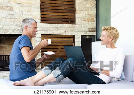 Stock Image - Couple have coffee break. Fotosearch