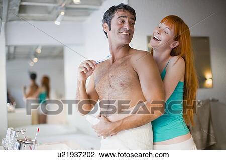 Couple hugging in bathroom View Large Photo Image Stock Image - Couple hugging in bathroom. Fotosearch