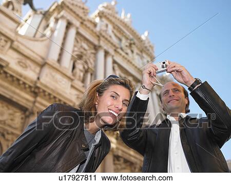 Couple in Venice, taking pictures View Large Photo Image Stock Image - Couple in Venice, taking pictures. Fotosearch