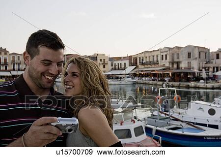 Stock Photo - couple looking at camera. Fotosearch