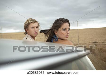 Couple looking back View Large Photo Image Stock Image - Couple looking back. Fotosearch