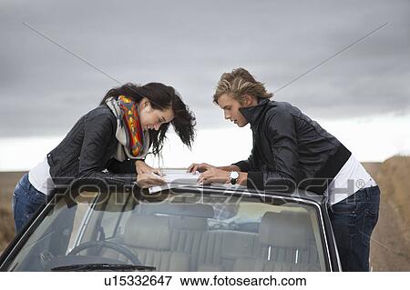 Stock Photo - Couple looking in map. Fotosearch