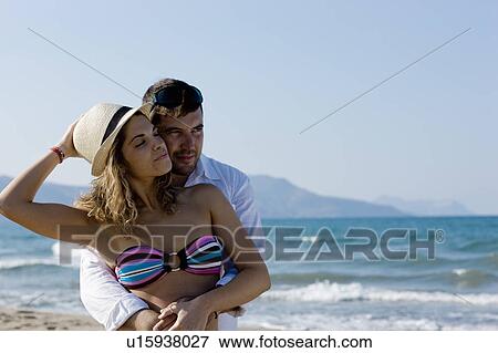 couple on the beach hugging View Large Photo Image Stock Photo - couple on the beach hugging. Fotosearch