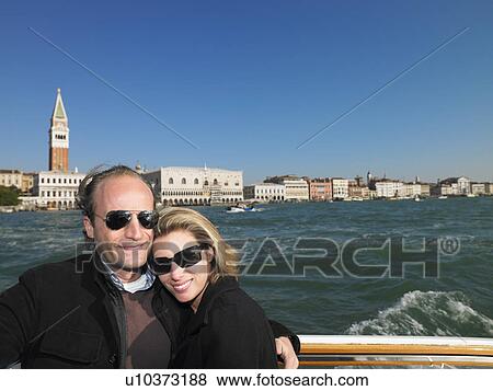 Couple on the sluice of Venice, Italy View Large Photo Image Stock Photo - Couple on the sluice of Venice, Italy. Fotosearch