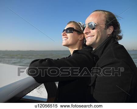 Stock Photography - Couple on the sluice of Venice, Italy. Fotosearch