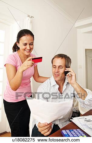 Couple pay bill with credit card View Large Photo Image Stock Photography - Couple pay bill with credit card. Fotosearch