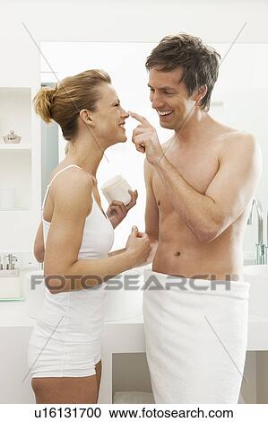 Couple playing in bathroom View Large Photo Image Stock Image - Couple playing in bathroom. Fotosearch