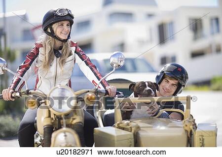 Couple riding a motorbike View Large Photo Image Stock Image - Couple riding a motorbike. Fotosearch