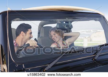 Couple riding in jeep together View Large Photo Image Stock Image - Couple riding in jeep together. Fotosearch