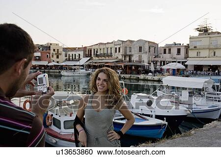 Stock Image - couple taking photo of each other. Fotosearch