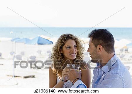 couple toasting near the beach View Large Photo Image Stock Image - couple toasting near the beach. Fotosearch