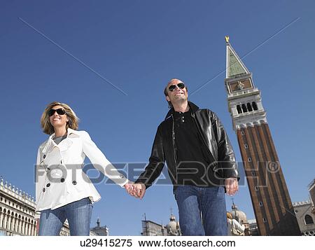 Stock Photography - Couple walking in Venice, Italy. Fotosearch