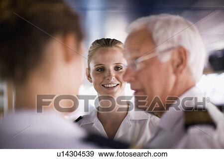 Stock Photo - Crew of a ship talking. Fotosearch