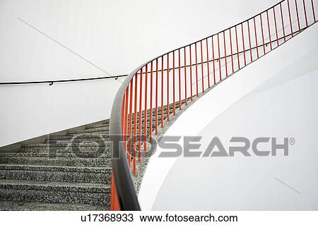 Curved stairs with red banister View Large Photo Image Stock Image - Curved stairs with red banister. Fotosearch