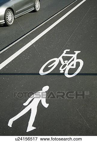 Cycling lane symbol and car View Large Photo Image Stock Photo - Cycling lane symbol and car. Fotosearch