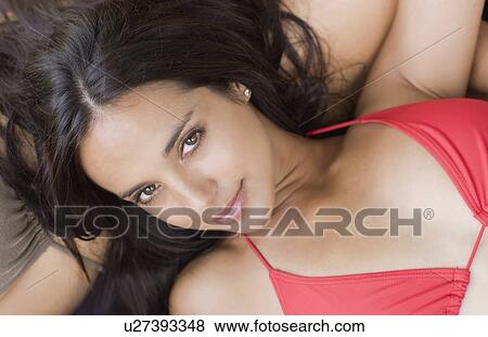 darkhaired woman sunbathing View Large Photo Image Stock Photo - darkhaired woman sunbathing. Fotosearch