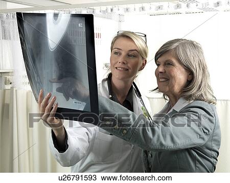 Doctor and patient with x-ray View Large Photo Image Stock Image - Doctor and patient with x-ray. Fotosearch