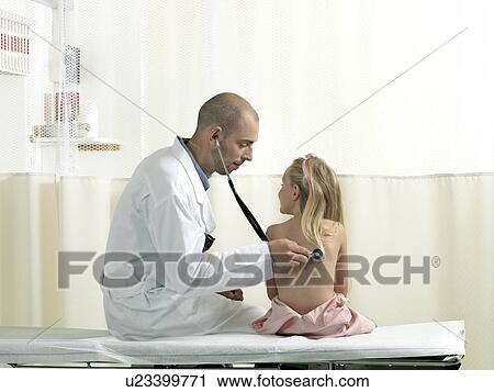 Stock Image - Doctor examining girl. Fotosearch