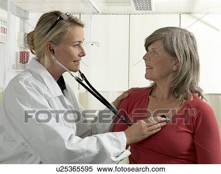 Stock Photography - Doctor examining mature woman. Fotosearch