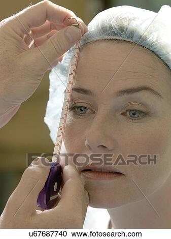 Doctor preparing patient for surgery View Large Photo Image Stock Image - Doctor preparing patient for surgery. Fotosearch