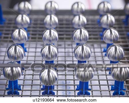 Engineered medical parts on wire rack View Large Photo Image Picture - Engineered medical parts on wire rack. Fotosearch