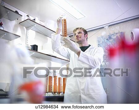 Picture - Expert analyzing brewery lab samples. Fotosearch