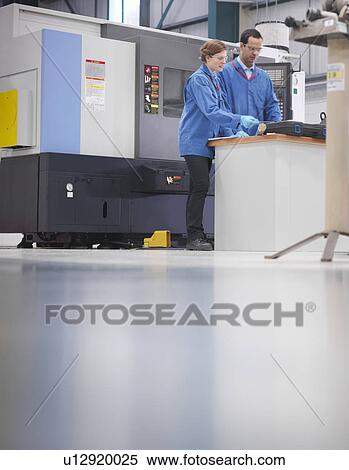 Factory engineers with machinery View Large Photo Image Stock Photography - Factory engineers with machinery. Fotosearch