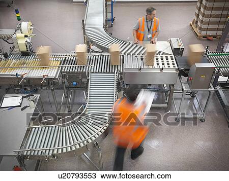 Factory workers in bottling plant View Large Photo Image Stock Image - Factory workers in bottling plant. Fotosearch