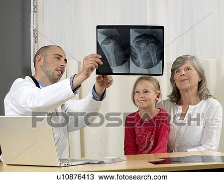 Stock Image - Family consulting doctor. Fotosearch
