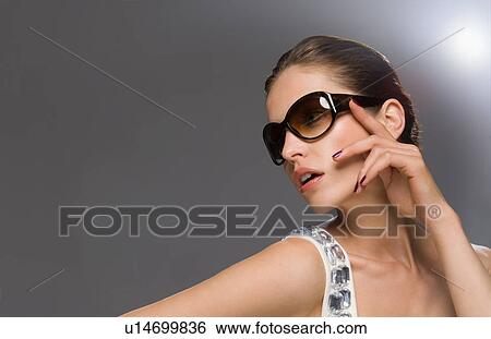 fashion model in glasses looking off camera View Large Photo Image Stock Photograph - fashion model in glasses looking off camera. Fotosearch