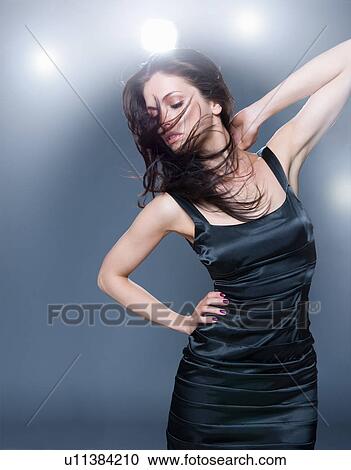 Stock Image - fashion model posing on stage. Fotosearch