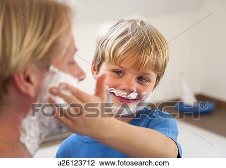 Father and son applying shaving cream View Large Photo Image Stock Image - Father and son applying shaving cream. Fotosearch