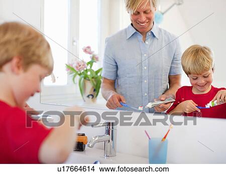 Father and son brushing their teeth View Large Photo Image Picture - Father and son brushing their teeth. Fotosearch