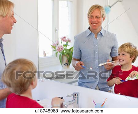 Father and son brushing their teeth View Large Photo Image Stock Photo - Father and son brushing their teeth. Fotosearch