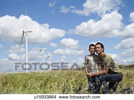 Picture - Father and son on a windfarm. Fotosearch
