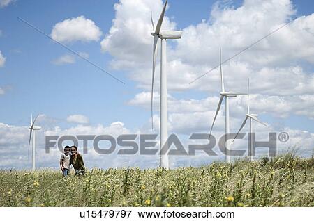 Father and son on a windfarm View Large Photo Image Stock Photo - Father and son on a windfarm. Fotosearch