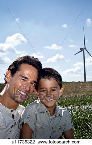 Father and son portrait on a wind farm View Large Photo Image Stock Image - Father and son portrait on a wind farm. Fotosearch