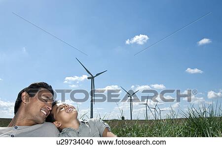 Stock Image - Father and son portrait on a wind farm. Fotosearch