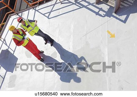 Female and male workers on a ship View Large Photo Image Stock Image - Female and male workers on a ship. Fotosearch