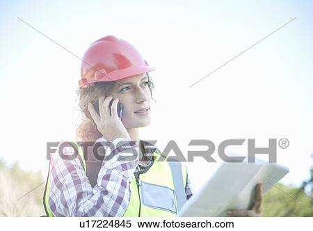 Stock Photography - Female Engineer on mobile phone. Fotosearch