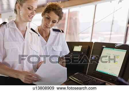 Female sailors doing their work View Large Photo Image Stock Photo - Female sailors doing their work. Fotosearch