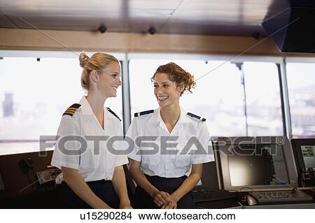 Picture - Female salors talking on ship. Fotosearch
